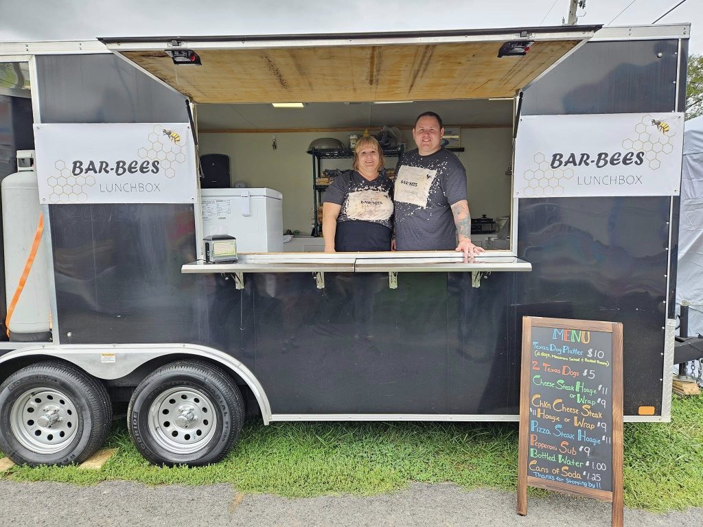 The Bar-Bees Lunchbox family and crew beside the food truck